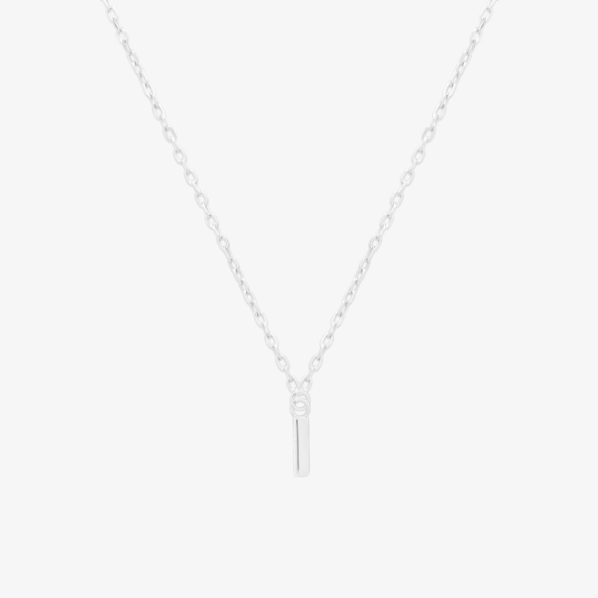 Classic initial pendant necklace featuring a polished letter charm on a delicate chain, showcasing a timeless and elegant design.